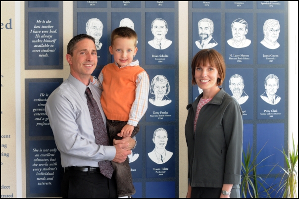 Travis Tubre, son, and wife Amber